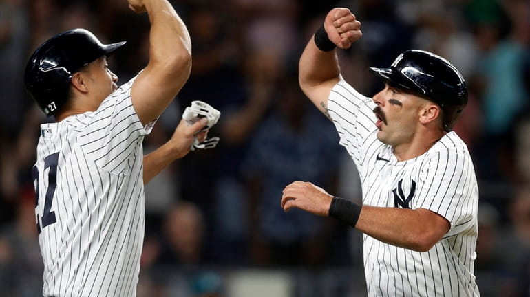 Matt Carpenter of the Yankees celebrates his 10th-inning two run home...