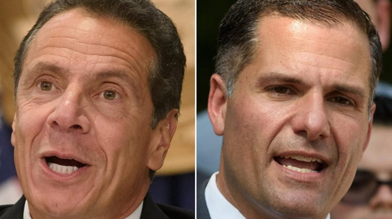 Gov. Andrew M. Cuomo, left, and Dutchess County Executive and...