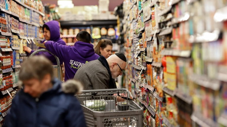 Shoppers at the Seasons kosher grocery on Central Avenue in Lawrence.