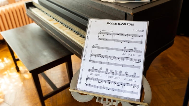 Sheet music for “Second Hand Rose” sits next to a...