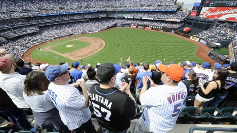 New York Mets' fans celebrate after the Mets' David Wright...