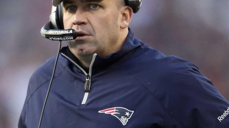 Offensive coordinator Bill O'Brien of the New England Patriots looks...