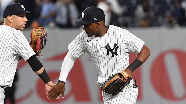 New York Yankees' Marwin Gonzalez and Miguel Andujar celebrate their...