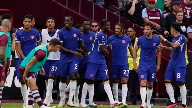 Chelsea's Carney Chukwuemeka, fourth from right, celebrates with his teammates...