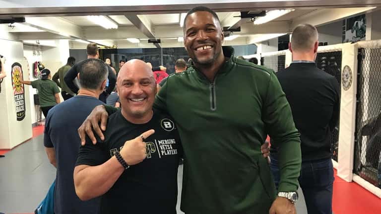 Jay Glazer and Michael Strahan at the opening of the...