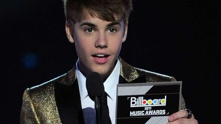 Justin Bieber speaks onstage during the 2011 Billboard Music Awards...