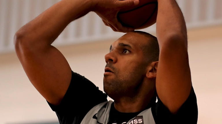 Brooklyn Nets forward Jared Dudley takes practice shots during training...