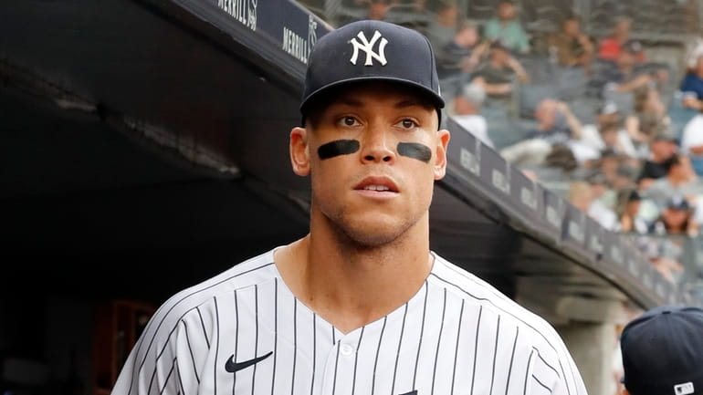 Aaron Judge #99 of the Yankees looks on before a game...