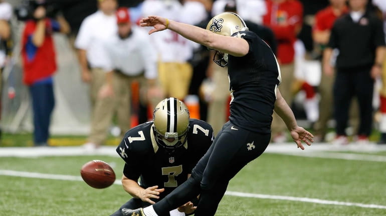 New Orleans Saints kicker Garrett Hartley kicks the game-winning field...