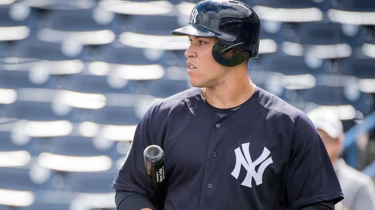 New York Yankees' Aaron Judge looks on at batting practice...