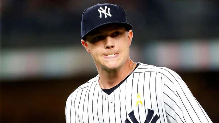 Sonny Gray of the Yankees walks to the dugout after...