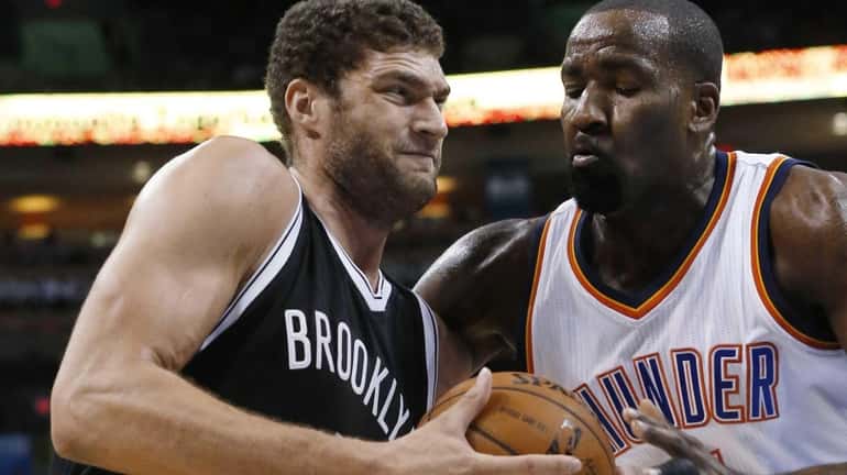 Brooklyn Nets' Brook Lopez, left, drives past Oklahoma City Thunder's...