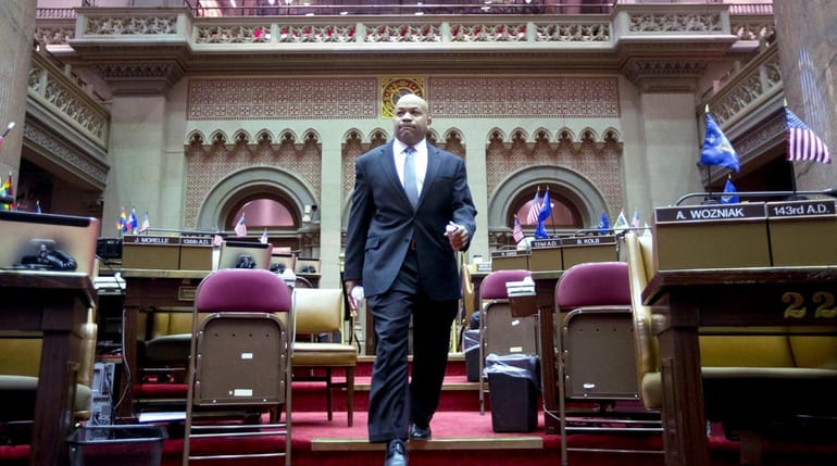 Assembly Speaker Carl Heastie (D-Bronx) walks through the Assembly Chamber...