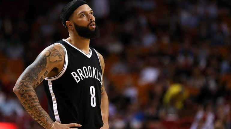 Deron Williams of the Brooklyn Nets looks on during a...