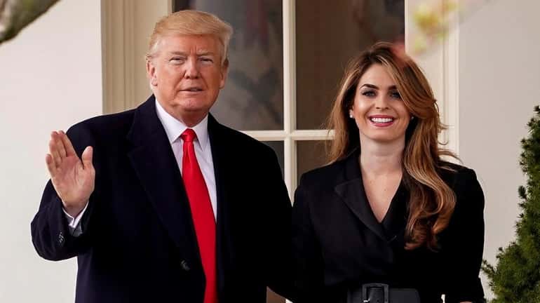 President Donald Trump with then-White House communications director Hope Hicks...