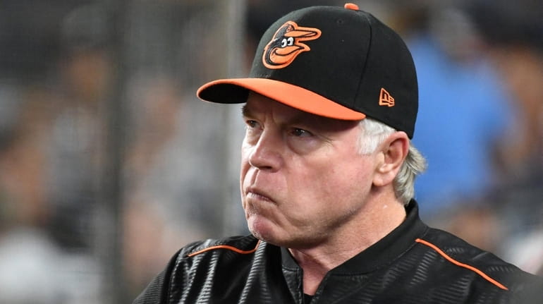 Baltimore Orioles manager Buck Showalter looks on from the dugout...