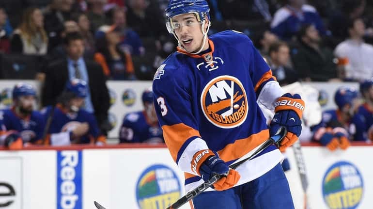 New York Islanders defenseman Travis Hamonic looks on against the...