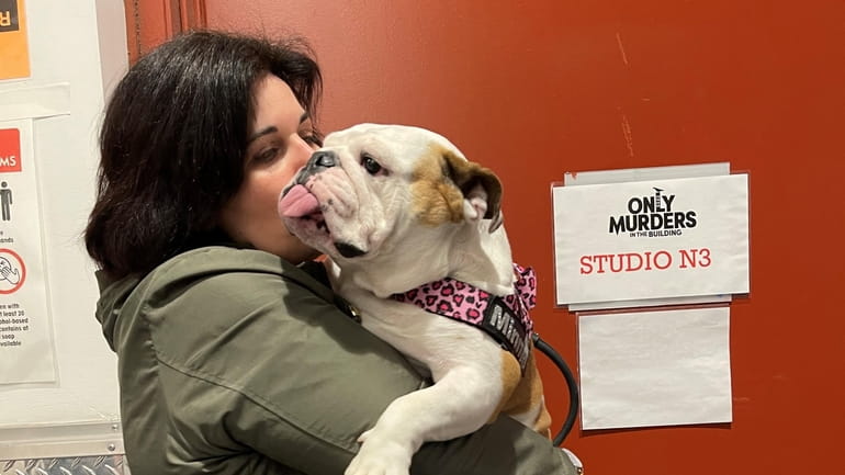 Owner Josephine Ciuzio gets some love from Minnie on the...