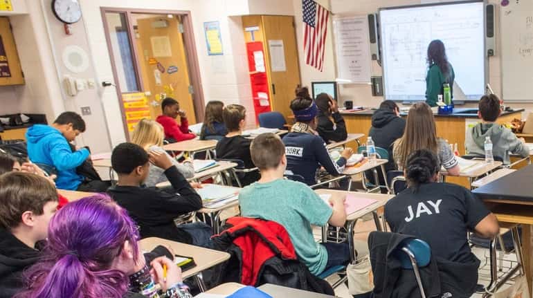 Eighth-grade students in a science classroom at Longwood Junior High...