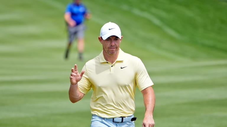 Rory McIlroy, of Northern Ireland, waves to the gallery as...