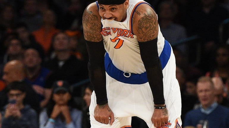 New York Knicks forward Carmelo Anthony looks on during a...