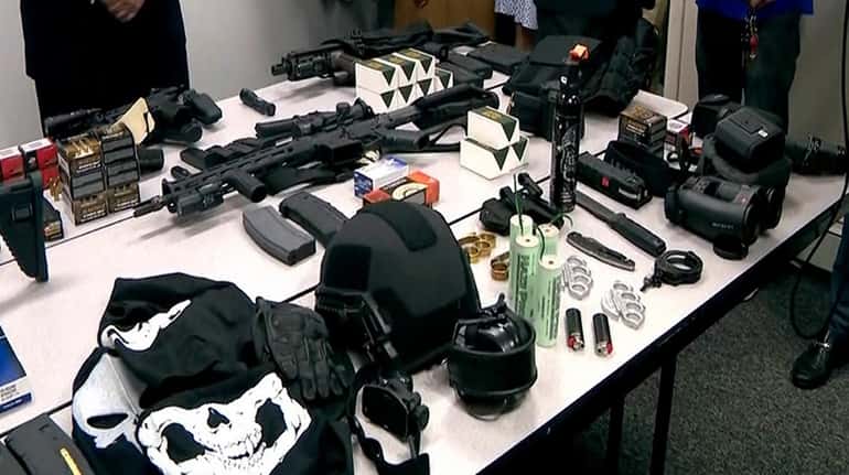 Tuckahoe Police Department on Wednesday displays seized weapons it says...