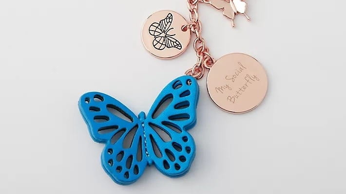 Personalized butterfly bag charm.