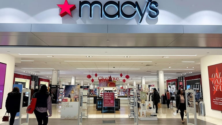Shoppers enter a Macy's department store in Bay Shore, Long...