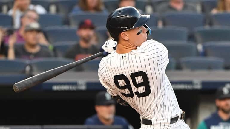 New York Yankees' Aaron Judge follows through on his two-run...