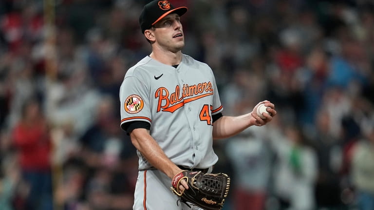 Baltimore Orioles starting pitcher John Means reacts after Cleveland Guardians'...