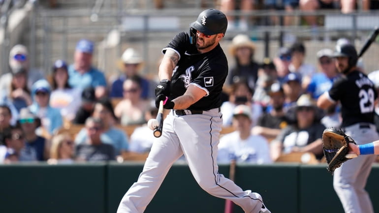 Chicago White Sox's Mike Moustakas pops out during the first...