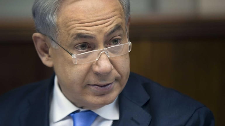 Israeli Prime Minister Benjamin Netanyahu heads the weekly cabinet meeting...