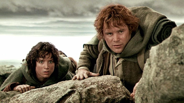 Elijah Wood, left, starred as Frodo, and Sean Astin played...