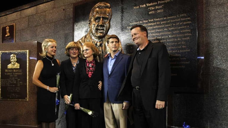 Members of George Steinbrenner's family pose following a ceremony dedicating...