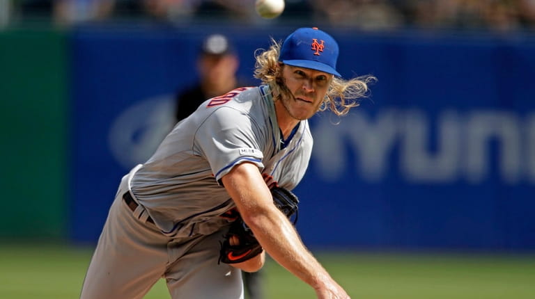 New York Mets starting pitcher Noah Syndergaard delivers during the...