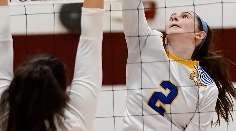 Kellenberg's Emily Acimovic, No. 2, with the spike against St. Anthony's during...