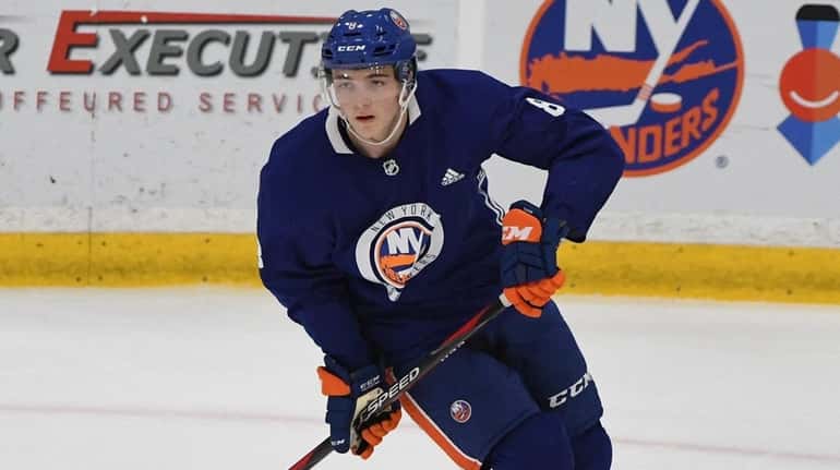 Islanders defender Noah Dobson skates during the Blue and White...