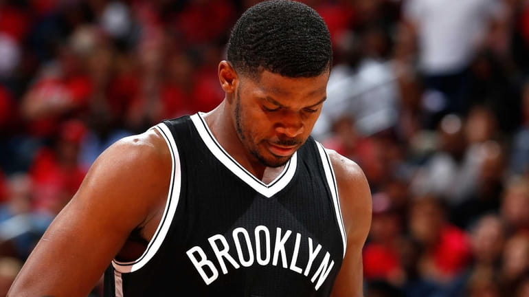 Joe Johnson #7 of the Brooklyn Nets reacts after a...