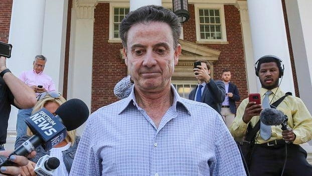 Louisville men's basketball coach Rick Pitino leaves Grawemeyer Hall after...
