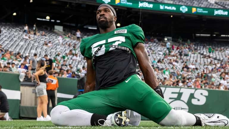 Jets linebacker C.J. Mosley stretches during the Green and White practice at...