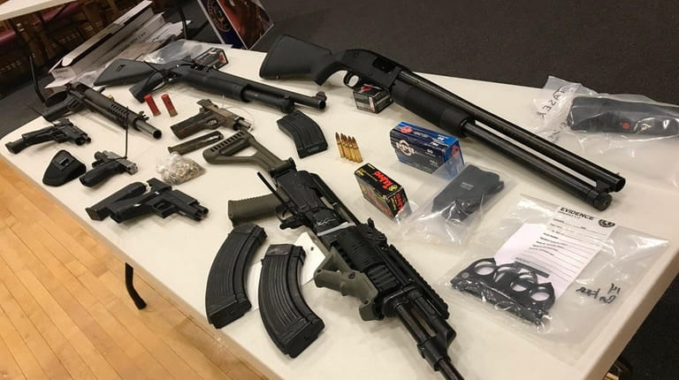 Weapons confiscated in a heroin bust authorities said was among...