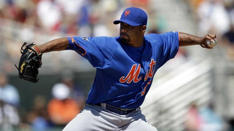 New York Mets starting pitcher Johan Santana delivers against the...