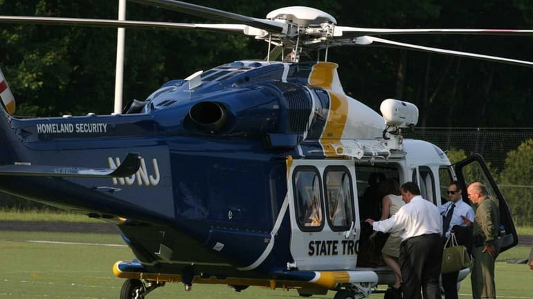 New Jersey Gov. Chris Christie leaves Montvale via helicopter after...
