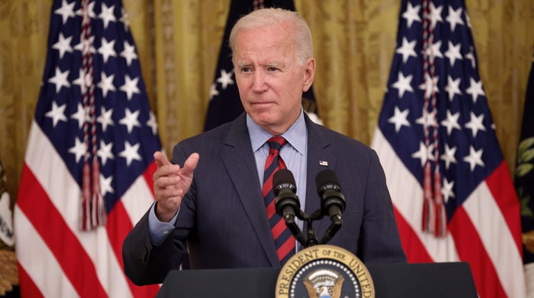 President Joe Biden takes questions at the White House Tuesday....
