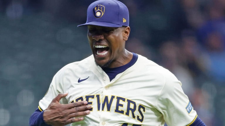 Milwaukee Brewers pitcher Thyago Vieira reacts after after striking out...