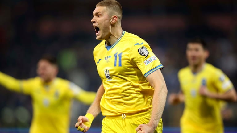 Ukraine's Artem Dovbyk celebrates after scoring his side's opening goal...