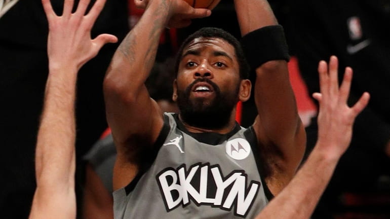 Kyrie Irving of the Nets puts up a shot during...