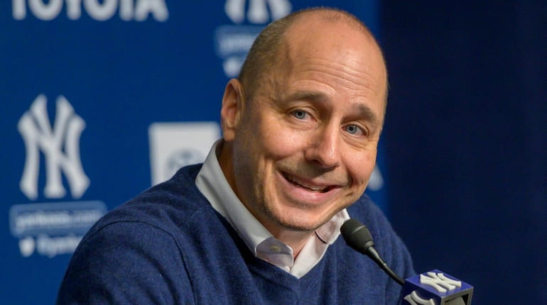Yankees GM Brian Cashman speaking at a news conference after...