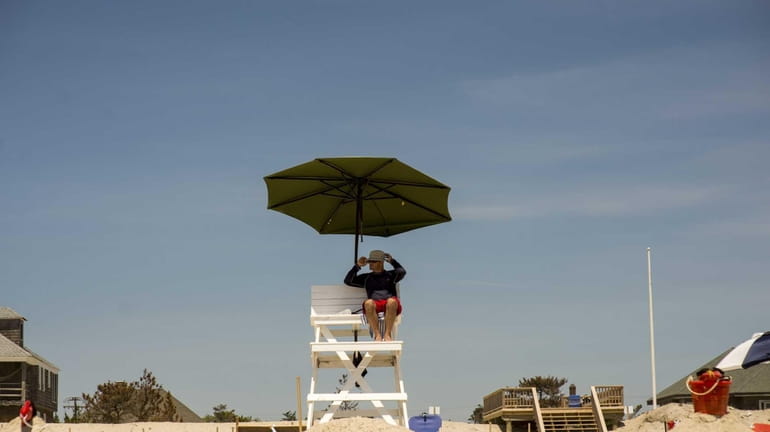 A lifeguard keeps watch over the beach at Ocean Bay...