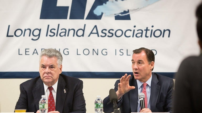 Rep. Tom Suozzi, right, speaks beside Rep. Peter King during...